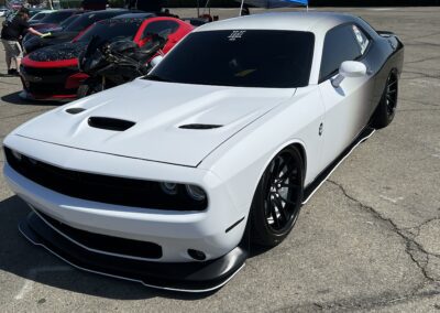 a white and black sports car parked