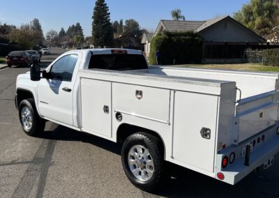 a white truck parked in a driveway